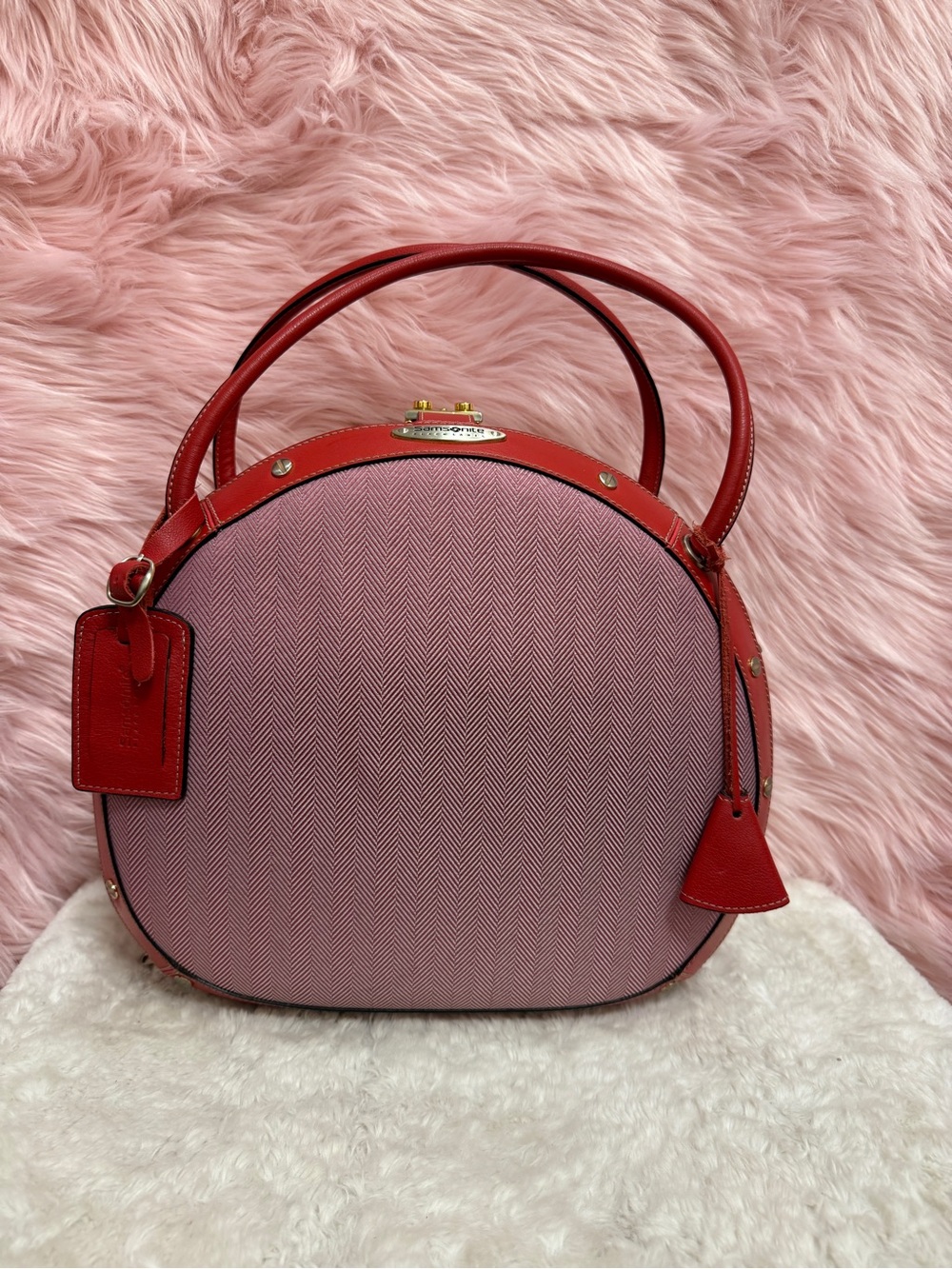 Samsonite Pink and Red Round Luggage Tote with Metallic Accents